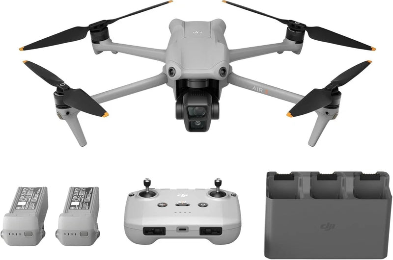 White quadcopter drone with front gimbal, controller, and two batteries