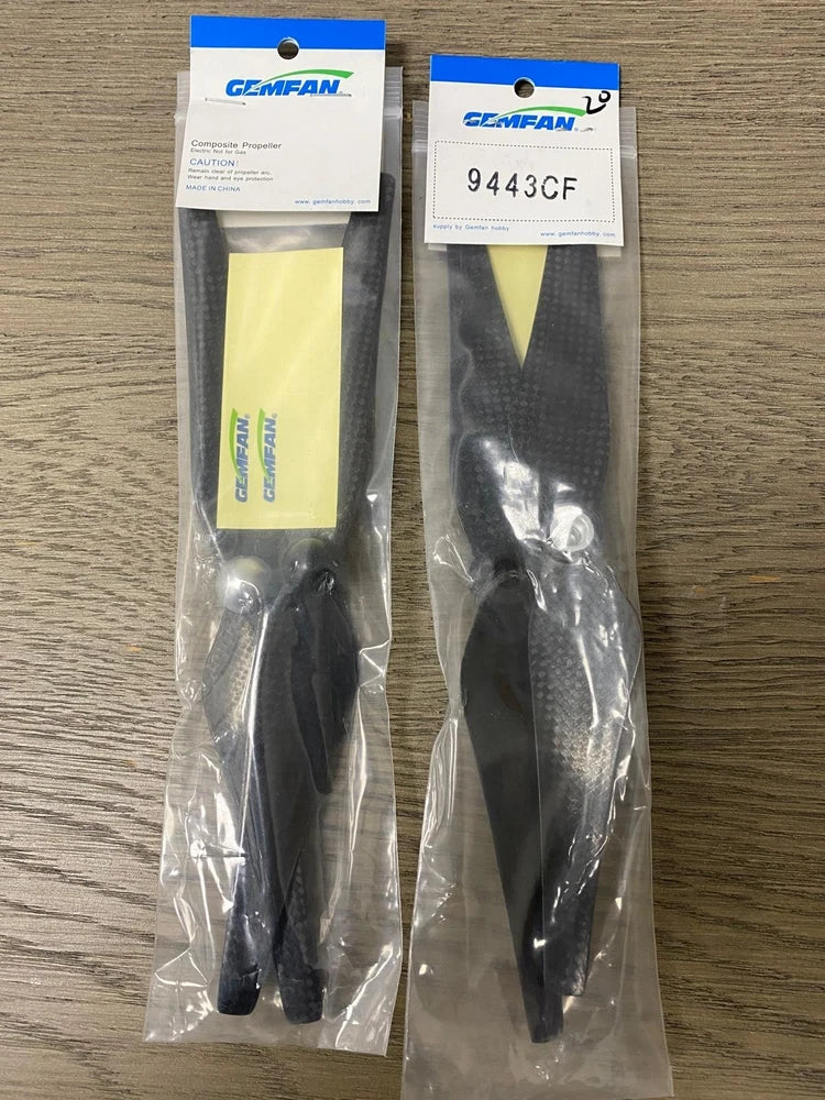Gemfan 9443CF propeller pair in clear packaging, carbon-fiber-look, black blades