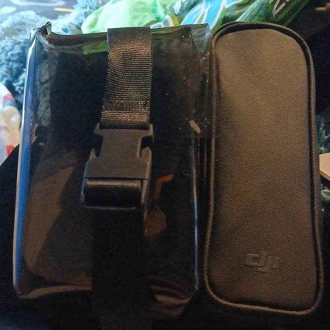 DJI Mini drone carrying case with zipper, molded compartment, and strap.