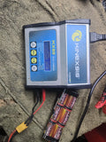 KINEXSIS KX80 LiPo battery charger with blue LCD screen and connected battery leads