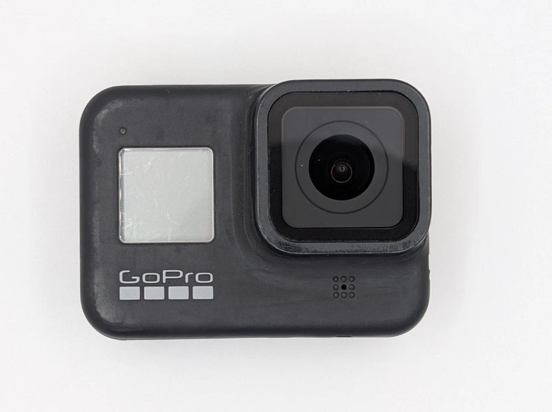 GoPro action camera, black housing with front lens and status icons, for parts