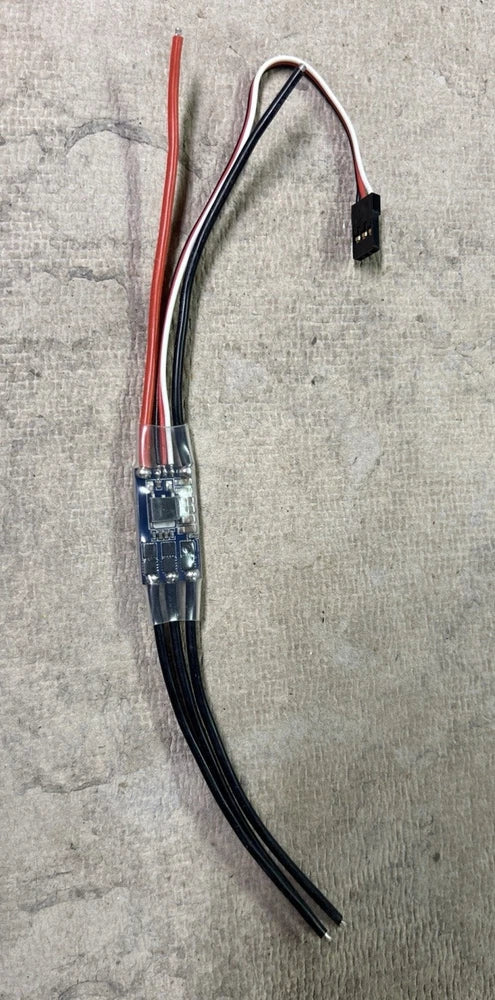 Brushless motor ESC PCB with red/blue wires and black leads, signal connector