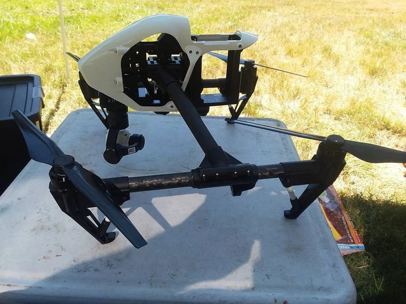 Quadcopter drone with gimbal camera mount and four propellers