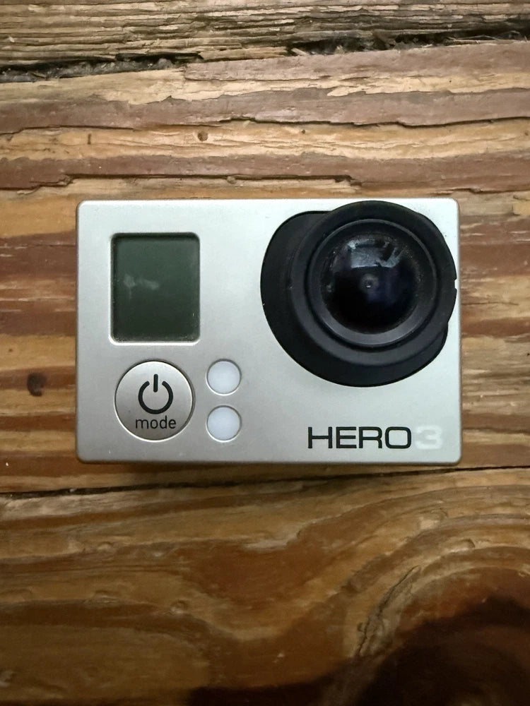 GoPro HERO3 action camera front, screen and mode buttons, lens on white body
