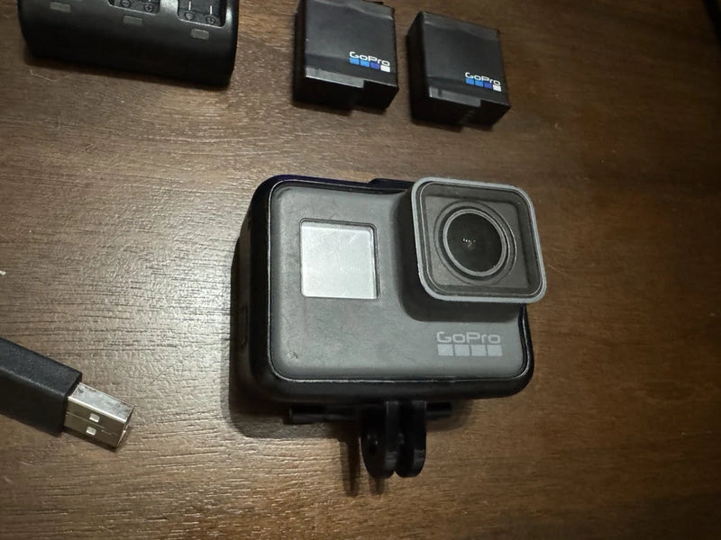 GoPro HERO5 action camera in black case with front lens and square display