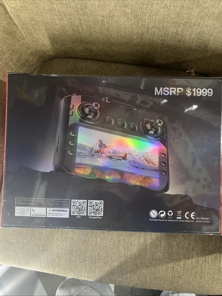 Drone remote control shown on retail packaging, with screen and buttons visible