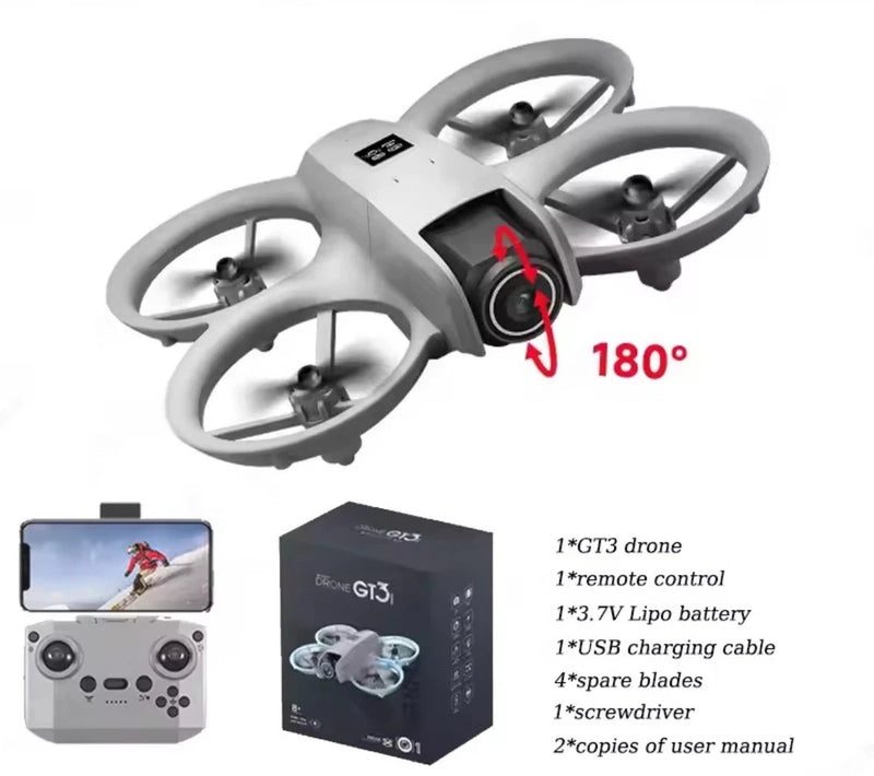 Mini quadcopter RC drone with gray body and four propellers, shown with remote and box