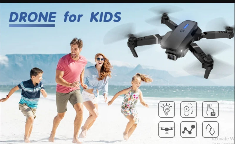 Quadcopter drone with attached camera and four propellers in gray and black