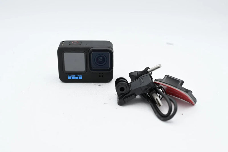 GoPro HERO10 Black action camera with mounting bracket and cable