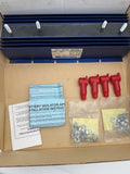 Blue multi battery isolator with mounting enclosure and red terminal covers, plus hardware bags