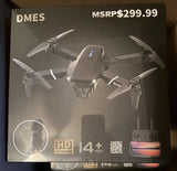 Gray quadcopter camera drone with four propellers on retail box