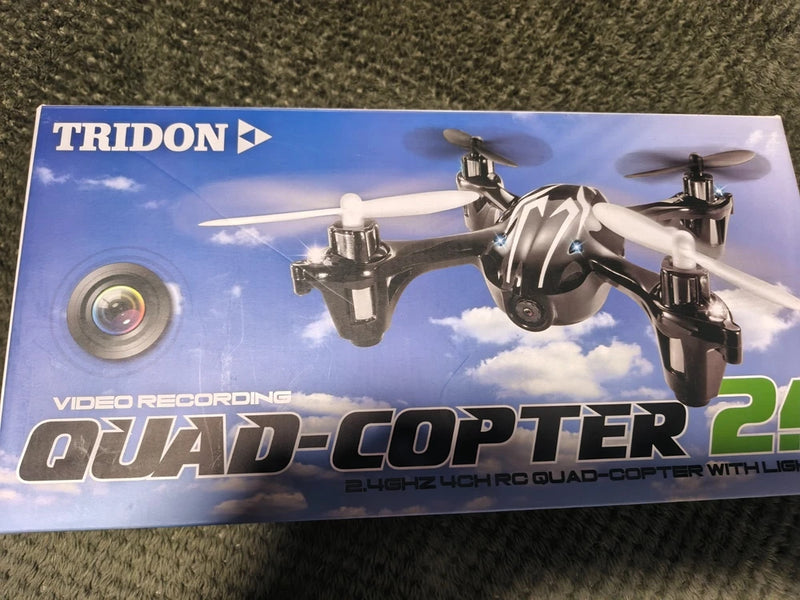 Boxed quad-copter drone package with camera lens and lights