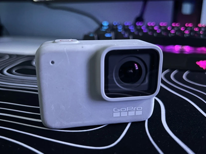 White waterproof action camera with square housing, front lens and GoPro logo