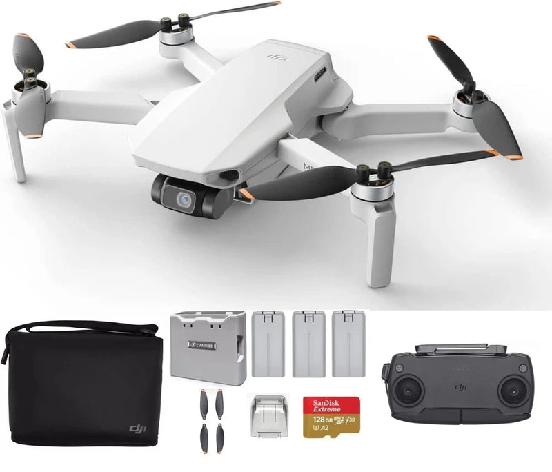 White quadcopter drone with camera, remote, batteries, props, and carry case