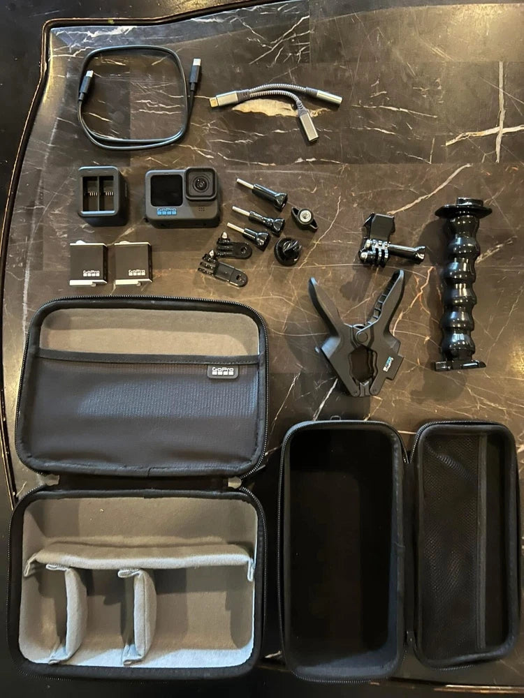 GoPro Hero11 Black action camera accessory kit in blue zip case with mounts and cables