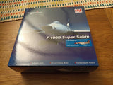 Die-cast F-100D Super Sabre aircraft model in retail display box with artwork
