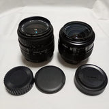 Black zoom lens set with two lenses and front/rear caps for Nikon F mount cameras