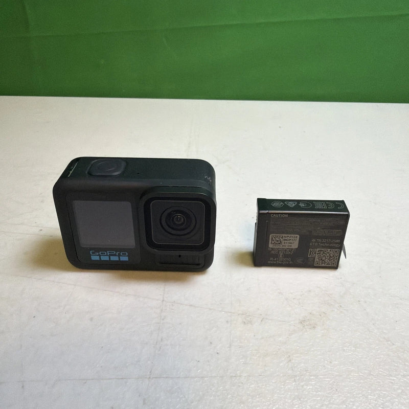 GoPro HERO13 black action camera with lens and front display, shown with box