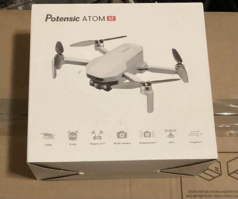 Potensic ATOM SE GPS 4K quadcopter drone with foldable white propellers on box