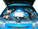 Blue cold air intake kit with intake tube and airbox in engine bay