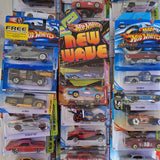 Set of Hot Wheels die-cast cars in blister packaging, assorted colors and designs