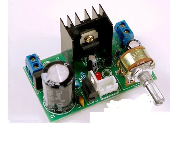 LM317 adjustable voltage regulator module with green PCB, screw terminals, and knob