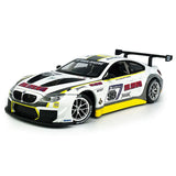 White diecast race car model with front grille, hood decals, and rear spoiler