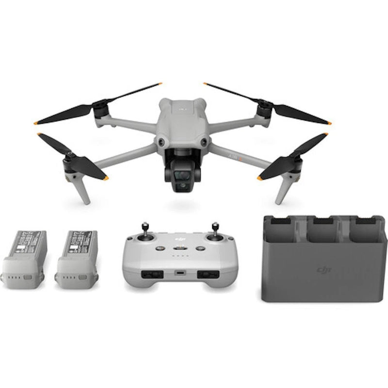 Folded quadcopter drone with camera, RC controller, extra batteries and carrying case