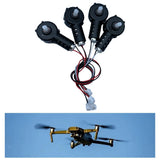 Set of four RC drone motors with prop hubs and wiring harness