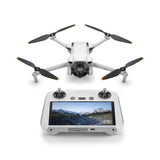 Foldable white quadcopter drone with propellers and remote controller with screen
