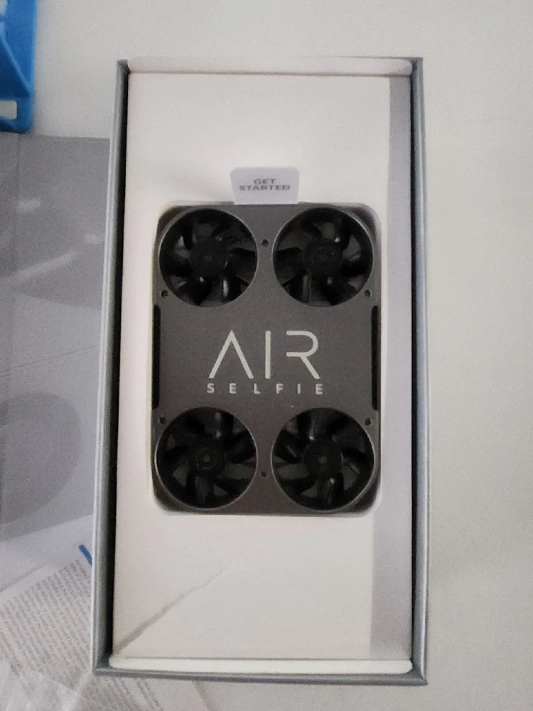 AIR Selfie 2 drone in retail box with four black propellers visible