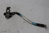Tesla Model S negative battery terminal with connected wiring cable, black clamp and blue insulator