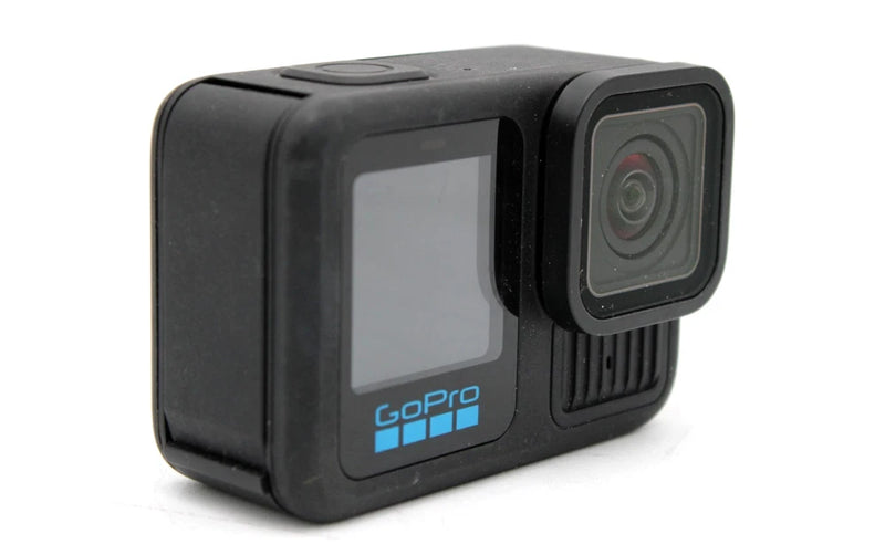 Black action camera with cracked front screen and built-in lens housing