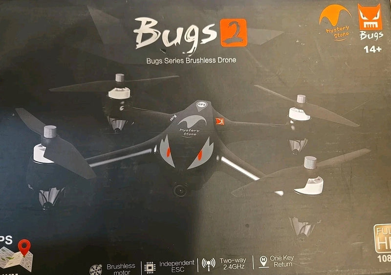 Black quadcopter drone with four propellers and front camera housing