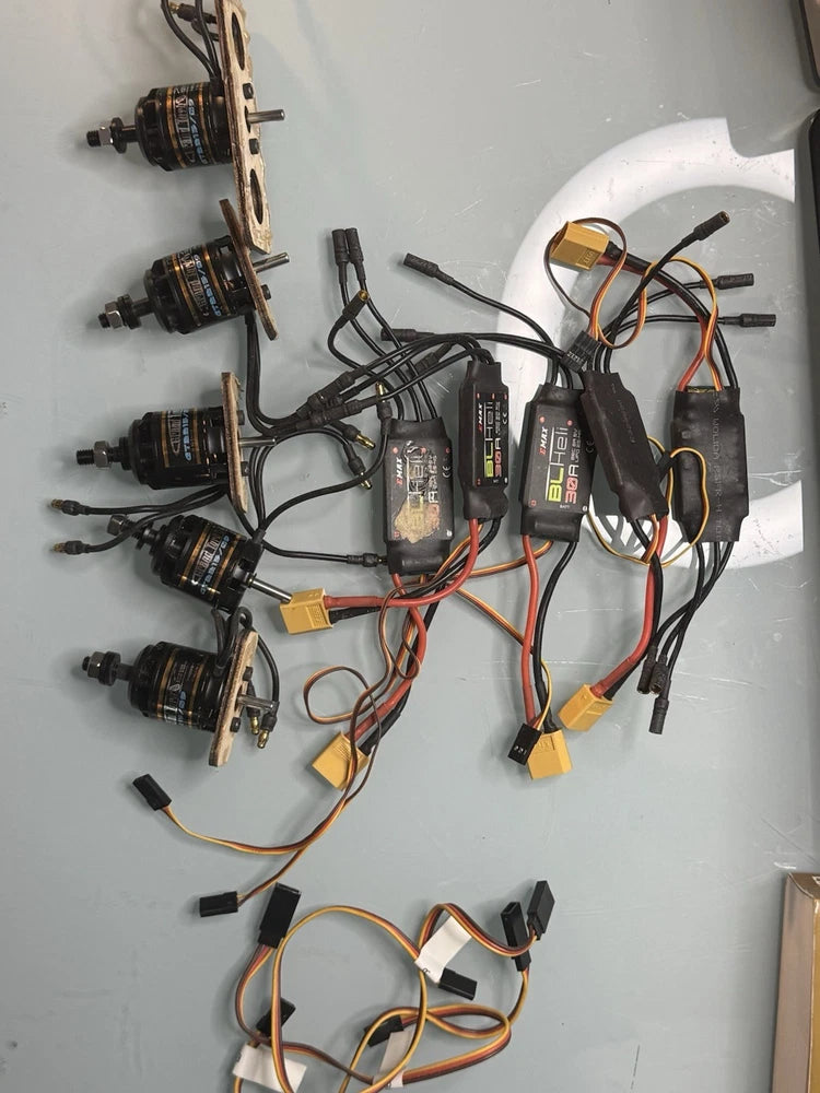 Drone parts lot with 5 brushless motors, 5 BLHeli 30A ESCs, and wiring harness