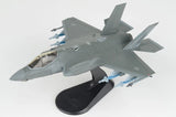 F-35A Lightning II 1/72 model aircraft, grey jet on black display stand, side view.