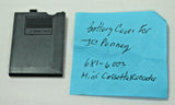 Mini cassette recorder battery cover, dark gray plastic with latch opening