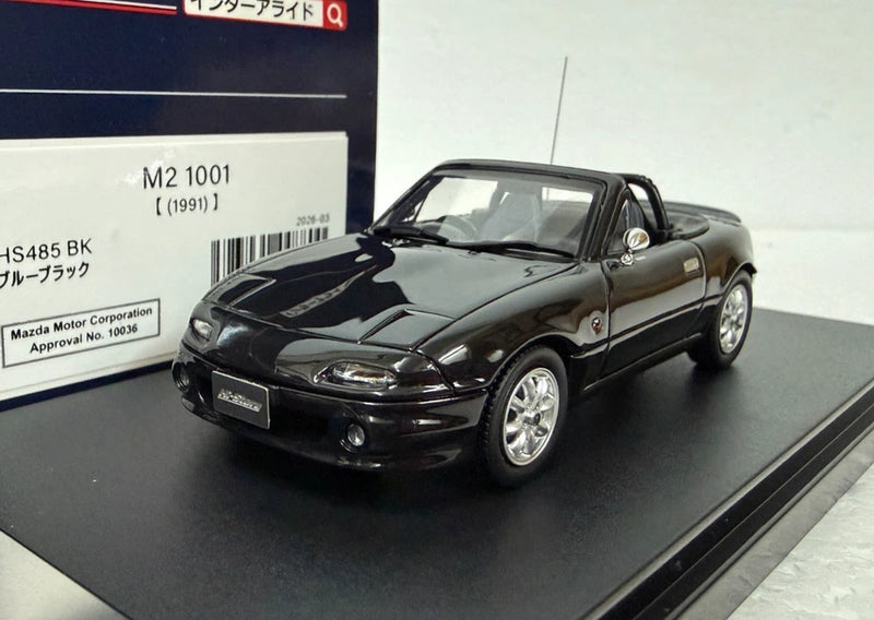 Hi Story Mazda M2 1001 1/43 scale model roadster, dark gray/black, front 3/4 view