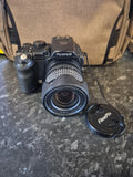 Fujifilm D-SLR-style bridge camera with 28–300mm zoom lens and strap