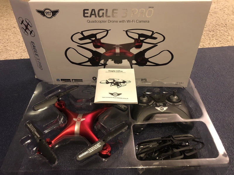 Red and black quadcopter drone with Wi-Fi camera, in retail box