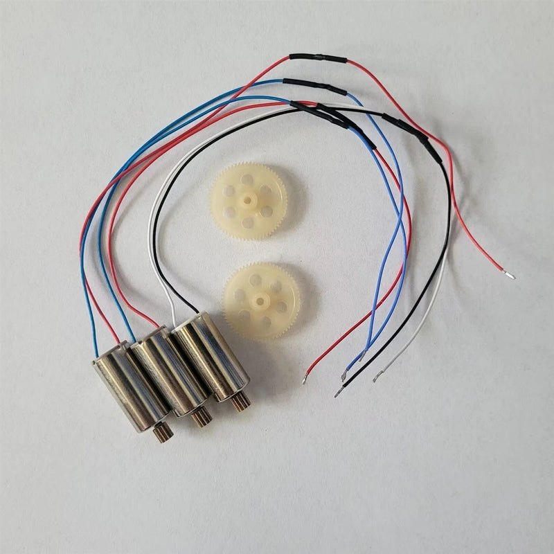 Drone motor and gear set with red/blue wiring and two white plastic gears, cylindrical motors