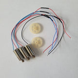 Drone motor and gear set with red/blue wiring and two white plastic gears, cylindrical motors