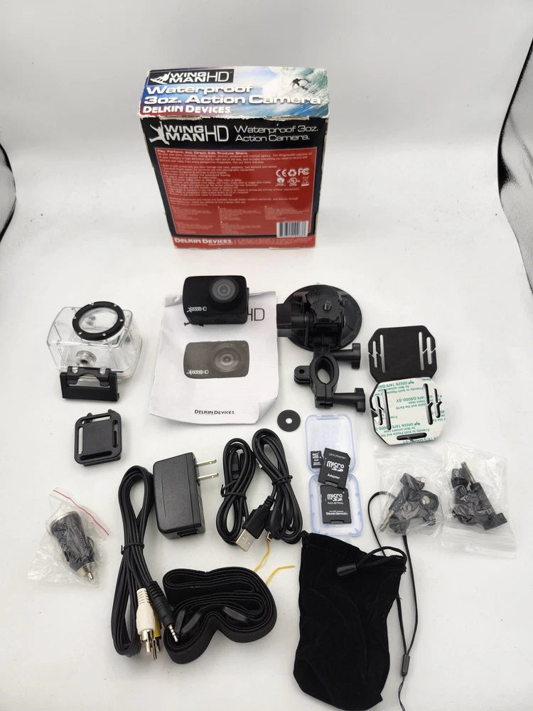 Waterproof action camera kit with black camera, mounts, cables, and carrying pouch