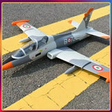 Gray fixed-wing RC EDF jet airplane with ducted fan intake and orange-tipped wings