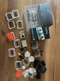 GoPro HD Hero2 action camera with mounts, housings, and extra accessories