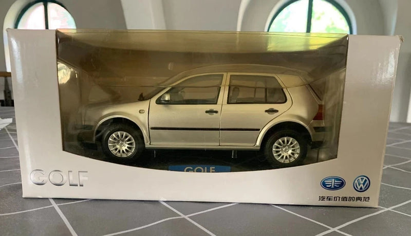 Volkswagen Golf 4 die-cast car model in display box, side view