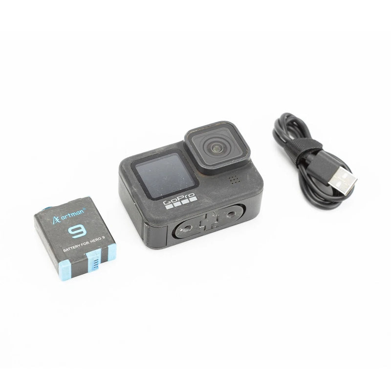 GoPro HERO9 Black action camera with LCD screen, lens, USB cable and battery pack