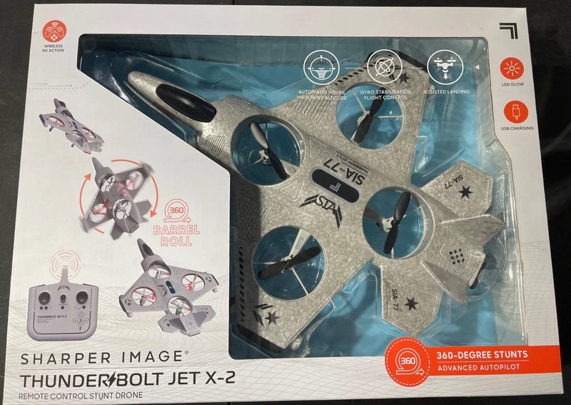 RC stunt drone in retail box with remote controller and visible propellers