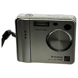 Silver Fujifilm FinePix F401 compact digital camera, front with lens and controls