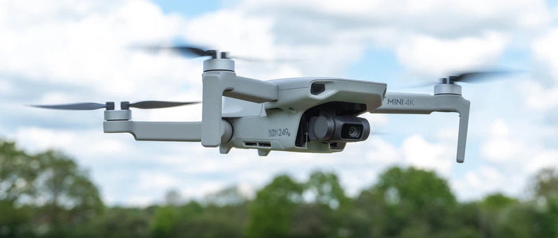 DJI Mini 4K drone with 4K camera, white quadcopter with four propellers
